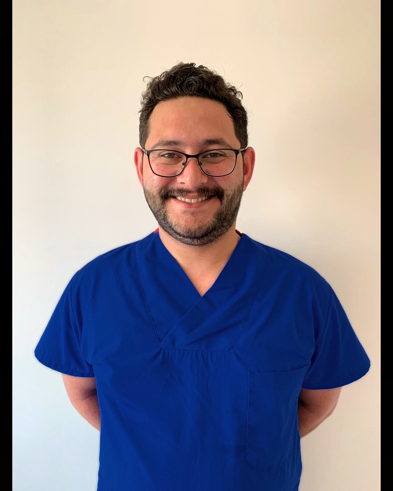 Portrait of Dr. Burak Aydınoğlu (Dr. Bay), MD and hair restoration surgeon at Sapientia Health.